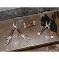 MAGNUM. Folding pliers with multi-function tools in stainless steel and wood